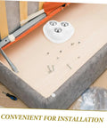 Eight Piece Stainless Steel Self Adhesive Caster Wheels With Smooth Ball Bearings For Effortless Furniture Relocation And Heavy Duty Storage Box Glide Conversion Today installed under a sofa for easy furniture movement.