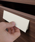 No Sweat Peel And Stick Finger Pull Handles For Cabinets, Screwless Adhesive Drawer Knobs that bond to wood, installed on a drawer.