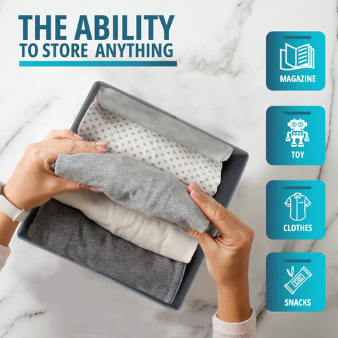 Person arranging clothes inside black durable fabric 11 inch cube storage bin with handles, foldable cubby organizer for closet shelves