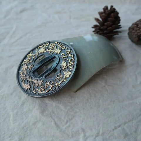 Close-up of Koshirae Style Samurai Sword with Alloy Tsuba in black and gold morning glory pattern, display piece for collectors.