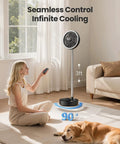 Woman using remote with Portable Pedestal Fan With 16000mAh Battery, Up To 74 Hours Runtime, Foldable Oscillating Desk Fan, indoors.