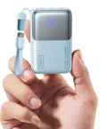 Hand holding Ultra Mini 10000mAh USB C Power Bank With 45W Fast Charge, Flight Safe Travel Battery Pack With Cable