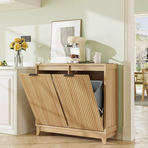 Fluted double tilt out trash can cabinet with odor control and built-in outlets in a modern kitchen setting, showing soft-close doors.
