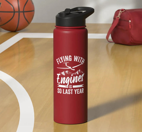 Red insulated stainless steel water bottle for sailplane pilots and glider enthusiasts on wooden surface.