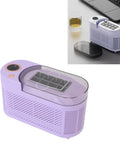 Compact Counter Ice Maker Cranks Out Eight Chill Cubes Quick And Slick Lil Build in lavender color on a desk with a drink.