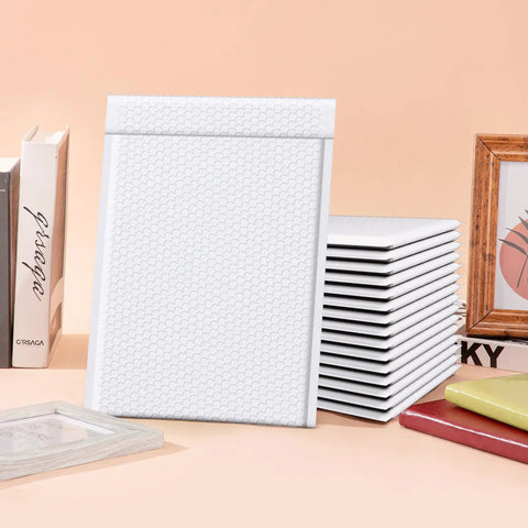 10.5x16 Inch Bubble Mailers 25 Pack Self Seal Padded Envelopes Waterproof Shipping Bags shown with books and frame