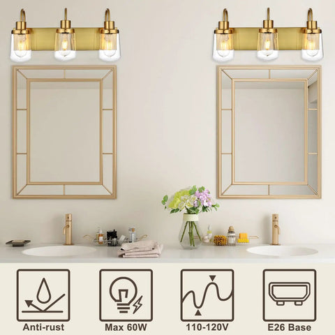 Three Light Sleek Brushed Nickel Vanity Fixture With Clear Glass Shades Over Mirror For Modern Bathroom Lighting