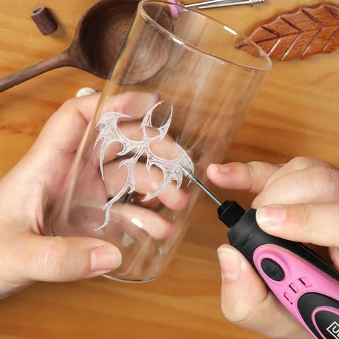 Using Pink 4V Cordless Rotary Tool Kit With 42 Accessories For DIY Crafts, engraving floral design on glass effortlessly
