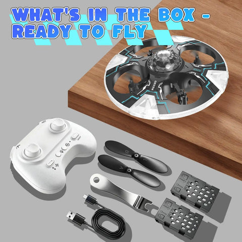 UFO Hand Controlled Drone For Kids with controller, blades, batteries, and charger, showcasing what's in the box.