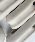Close-up of glazed ceramic surface, part of Glazed Ceramic Antenna Insulators, 22 Pack, Small Ceramic Isolators for antennas.