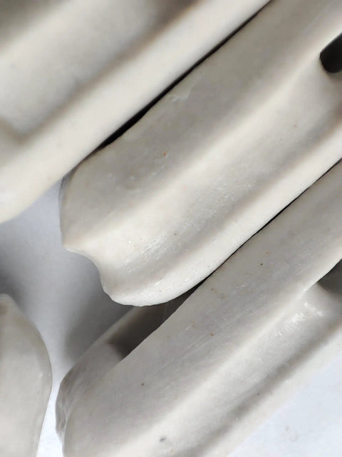 Close-up of glazed ceramic surface, part of Glazed Ceramic Antenna Insulators, 22 Pack, Small Ceramic Isolators for antennas.