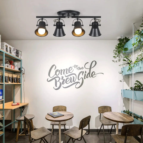 4 Light Track Lighting Kit In Industrial Black Finish With Adjustable Heads installed in a modern cafe setting.