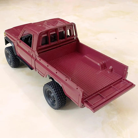 RC Beast Rock Crawler Truck 4x4 Toyota LC79 One Twelfth Scale Off Road Pickup rear view with open tailgate