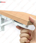 Heavy Duty Folding Shelf Brackets Set 2 Piece Metal Wall Mounted Triangle Supports Fold Down Design White 10 Inch in use
