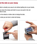Heavy Duty Self Inking Date Stamp Offering Custom Two Line Settings With Dual Blue And Red Pads For Crisp Prints And Zero Mess Setup being set for date adjustment.