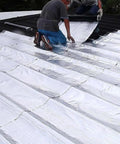 Two people applying Beefy Leak Stopper Self Adhesive Roofing Tape For Shed Repairs on a roof for leak sealing.