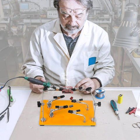 Technician using Pro Grade Six Arm Magnetic Helping Hands Soldering Station with heavy duty base for electronics repair