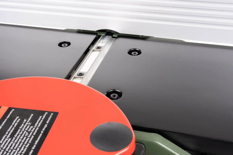 Close-up view of the 8 Inch Benchtop Jointer With Spiral Cutterhead And Teflon Coated Aluminum Tables, showcasing the flat table and adjustment screws.