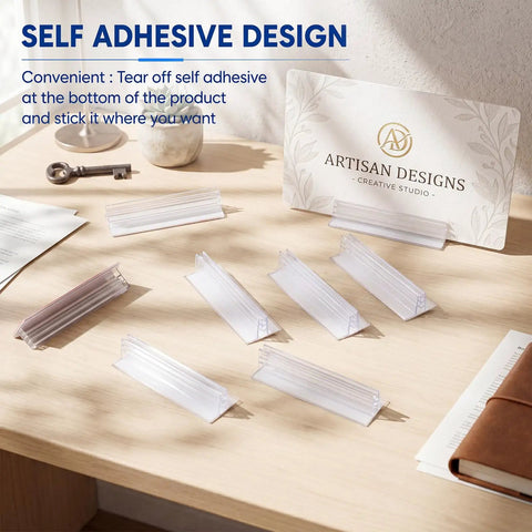 25 Pack Adhesive Base Sign Holders With Strong Backing For Counters And Shelves, Multipurpose Sign Displays For Restaurants, Retail And Warehouses, Easy Peel And Stick, 1 By 3 Inch clear PVC holders on a wooden counter