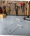 Heavy Duty T Handle Manhole Cover Hooks For Sewer And Septic Tanks Hella Tough Metal Lifters displayed on a workshop table.