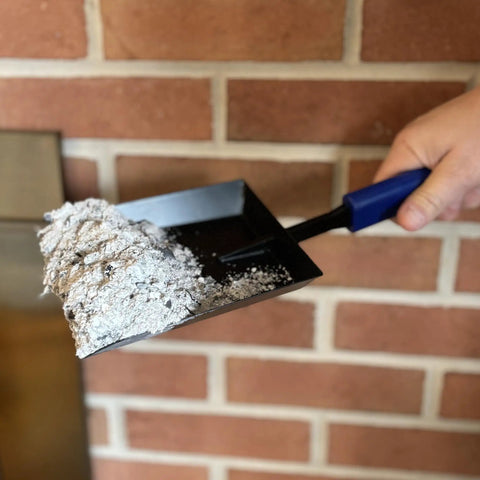 15 Inch Fireplace Ash Shovel With Wider Head For Quick Cleanup Heavy Duty Manganese Steel Scoop shown with ash