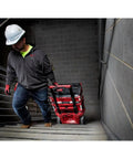 Person carrying Packout 22 Inch Tool Box With Heavy Duty Latches And Interior Organizer Trays Durable Modular Storage System on stairs