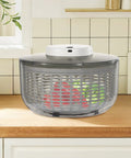 Game Changing Hella Big Electric Salad Spinner For Quick Lettuce Washing Knockout Battery Powered Produce Dryer on kitchen counter.
