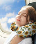 Woman using Sunflower Floral White Women's Neck Pillow With Memory Foam For Travel on plane, showcasing U shaped support.