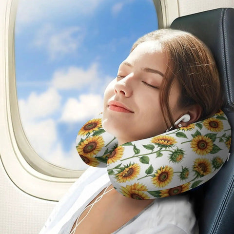 Woman using Sunflower Floral White Women's Neck Pillow With Memory Foam For Travel on plane, showcasing U shaped support.