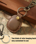 Premium Handmade Genuine Leather AirTag Holder And Keychain With Heavy Duty Rings Protective Case Compatible With Apple AirTags First And Second Gen Straight Up Solid Brown, featuring retro hanging buckles.