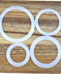 Silicone Gasket Replacement Set 10 Pieces For Coffee Pot Lids And Jar Seals visible on wooden surface