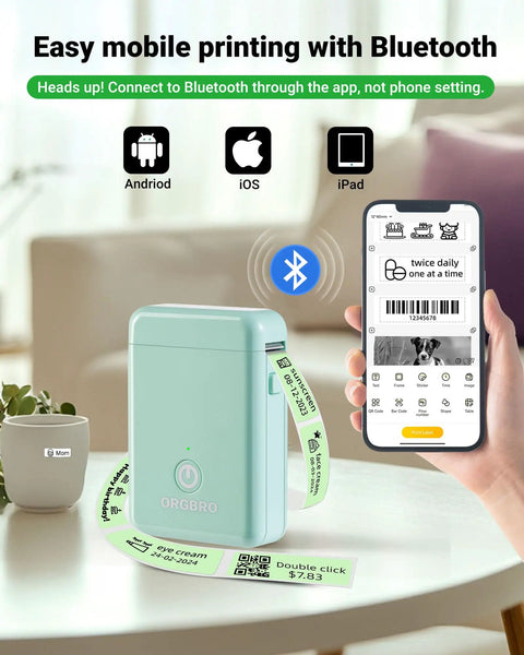 X1 Portable Bluetooth Label Printer With Tape Pre Cut And Continuous Labels Wireless Small Label Maker for Home School and Office Go To App For Quick Organization next to smartphone showing app interface on a table.