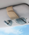 Nifty Beige Sunglass Holder For Car Sun Visor That Snaps Right On, holding sunglasses on a beige car visor.