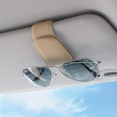 Nifty Beige Sunglass Holder For Car Sun Visor That Snaps Right On, holding sunglasses on a beige car visor.