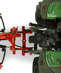 Kuhn GA 4731 GM 1:32 Scale Single Rotor Rotary Rake Die Cast Farm Implement accessory attached to a green tractor model