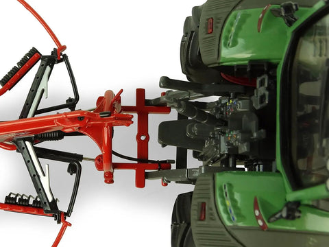 Kuhn GA 4731 GM 1:32 Scale Single Rotor Rotary Rake Die Cast Farm Implement accessory attached to a green tractor model