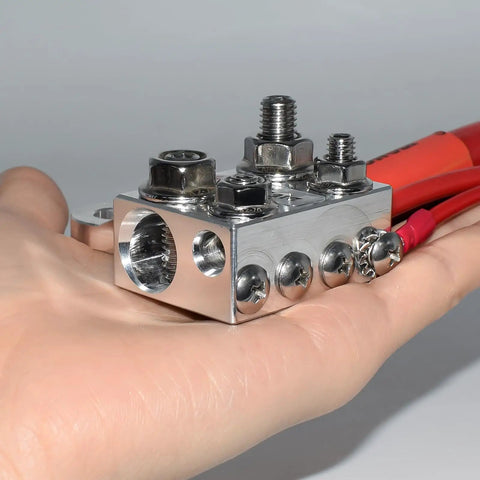 12 Way Battery Terminal Block And Bus Bar With Multi Size Connectors For Lithium Or Lead Acid Banks featuring 2 0 AWG connectors in hand.