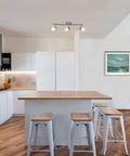 Three Light Kitchen Track Lighting With Modern S Shaped Ceiling Track Bar In Brushed Nickel Finish Lit in sleek kitchen setting