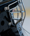 Close-up of helmet cage fastened with parts from 36 Piece Hockey Helmet Repair Kit Includes 6 R Shape Visor Clips 6 Rubber Gaskets 20 Screws