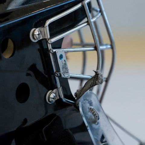 Close-up of helmet cage fastened with parts from 36 Piece Hockey Helmet Repair Kit Includes 6 R Shape Visor Clips 6 Rubber Gaskets 20 Screws