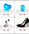 Rotating Display Stand With 10 Inch LED Light Turntable Base Black Spinning Platform showcasing blue heart and decorative items.
