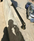 Vintage Bronze Metal Handrail Kit Indoor Outdoor Deck Railing System with shadows cast on a concrete surface.