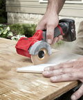 Wood Shaping Disc Set For 4 Inch Or 4 1/2 Inch Angle Grinders With 5/8 Inch Arbor, cutting wood panel using angle grinder.