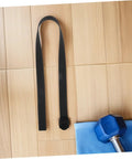 4 Pack Rowing Machine Foot Straps Replacement Nylon Pedal Straps With Non Slip Padding And Adjustable Elastic Fit For All Major Machines Easy Install Premium Comfort For Training Sessions black nylon strap with buckle on wood floor
