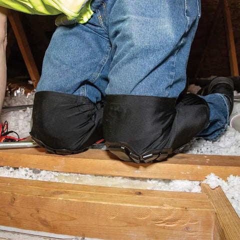 Heavy Duty Knee Pad Sleeves with Triple Layer Padding on kneeling person in attic for comfortable, slip-resistant support