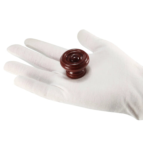 Kick Back Your Cabinet With Rock Solid Wooden Drawer Pulls Single Hole 37X25mm Red Brown Wood Hardware shown on white glove.