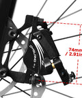 DYISLAND XT-7 black brake caliper mounted on a mountain bike wheel with 74mm reach.