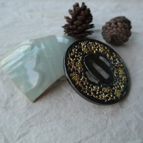 Close-up of alloy tsuba with black and gold morning glory pattern for Koshirae Style Samurai Sword With Alloy Tsuba 100 Black And Gold Morning Glor...