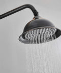 Close-up of large rainfall shower head from Modern Wall Mounted Shower System With Large Rainfall Shower Head And Ergonomic Handheld Sprayer Matte Black Bathroom Faucet Set.