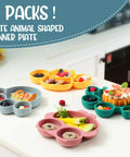 Hecka Adorable 4 Piece Silicone Toddler Suction Plate Set With Mega Grip Base Divided Animal Dishes For Babies on a kitchen counter.